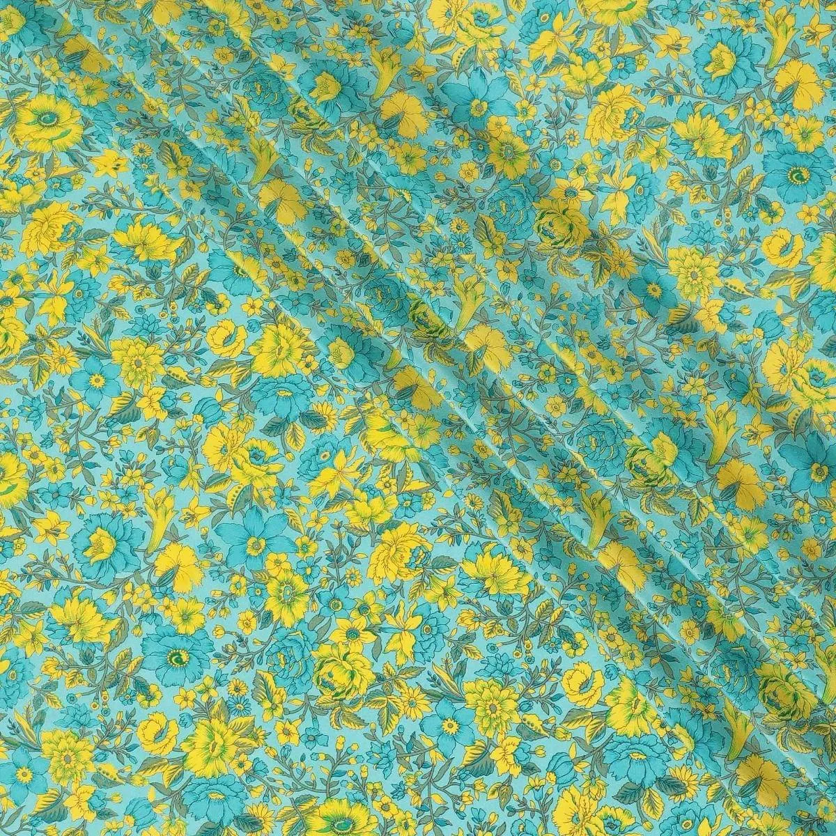 Turquoise blue silk crepe fabric with yellow, green and blye prints in floral design - D9911