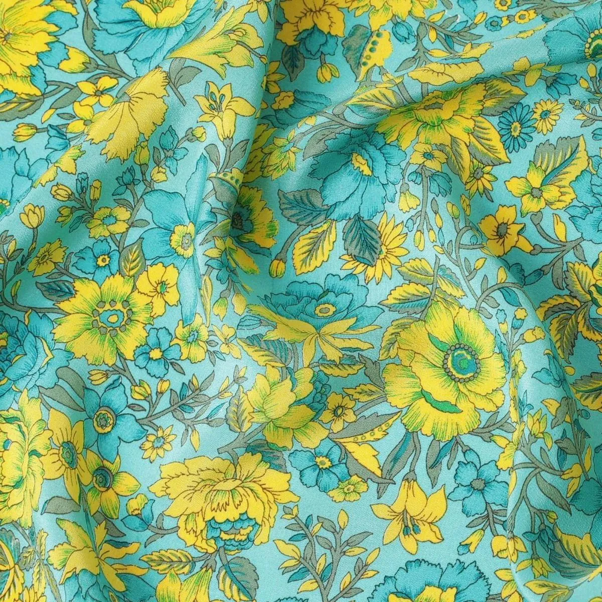 Turquoise blue silk crepe fabric with yellow, green and blye prints in floral design - D9911
